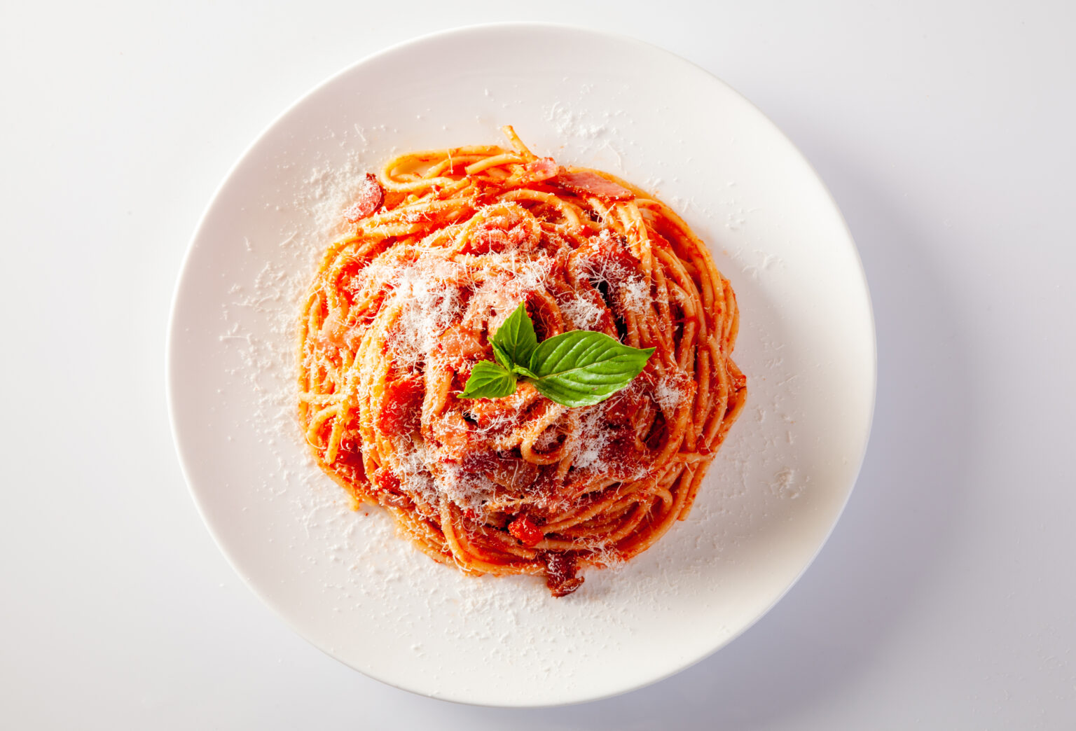 Spaghetti in a dish on a white background