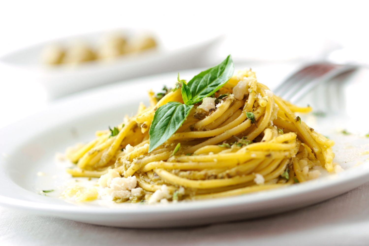 spagetthi with pesto sauce and cheese